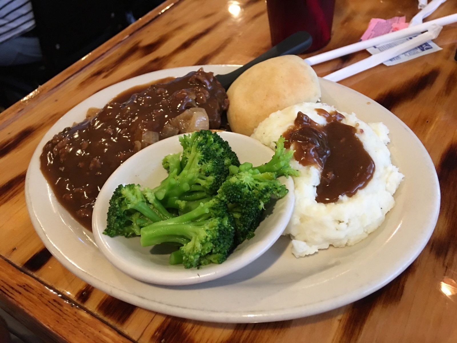 A comfort food plate with gravy, mashed potatoes and broccoli at The Galley in Morgan City.