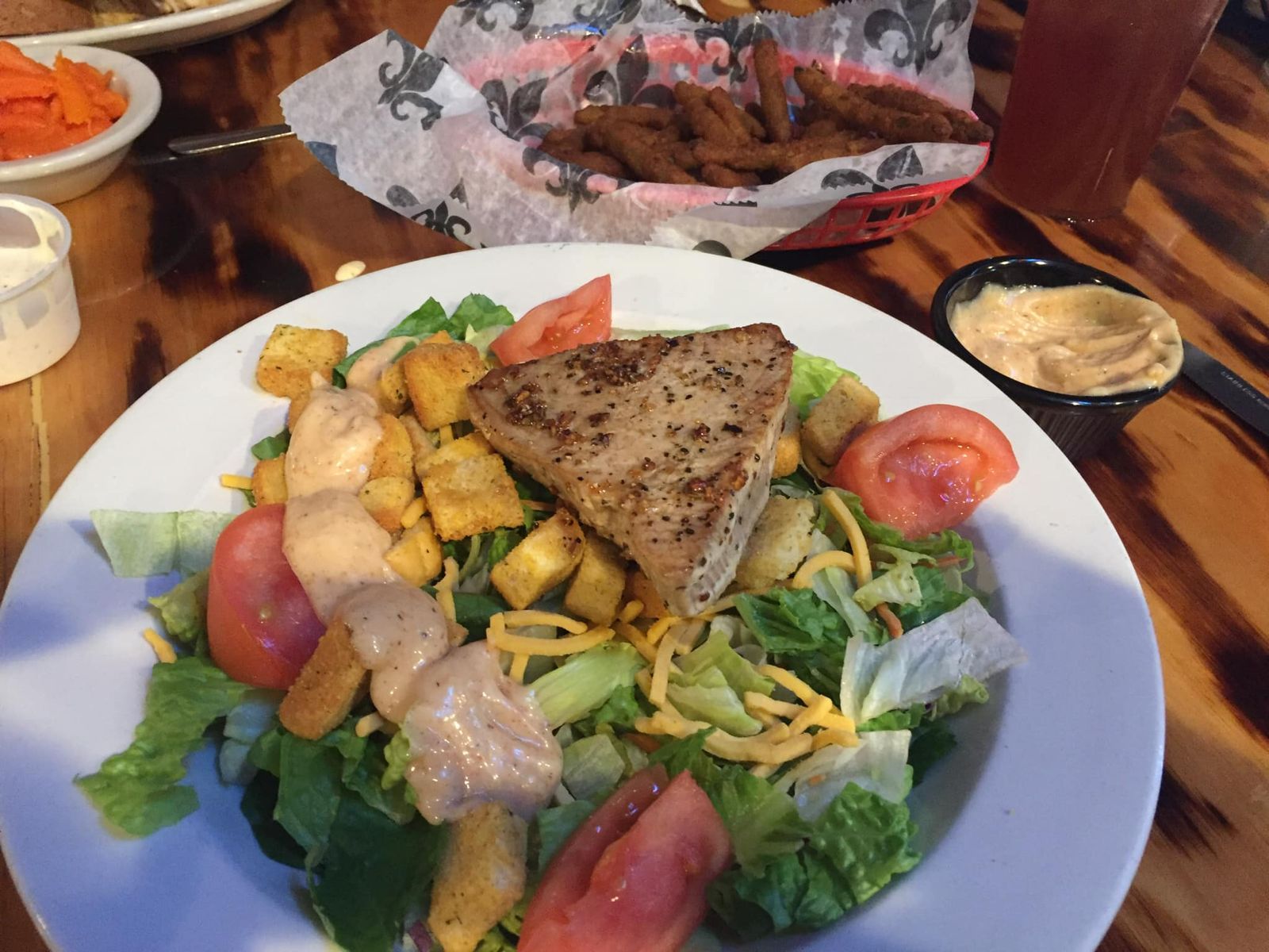 Grilled fish served over a garden salad at The Galley in Morgan City.